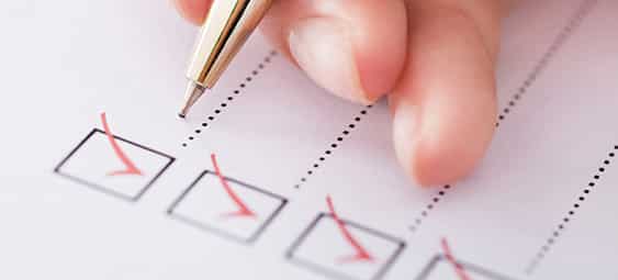 Businesswoman Writing On Checklist